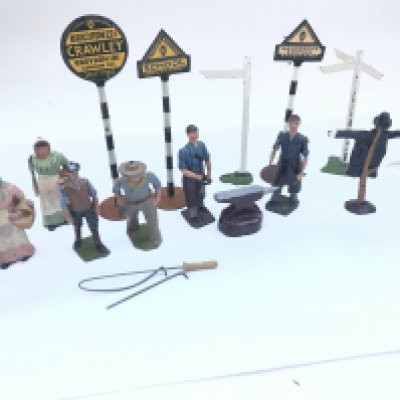 A Collection of Vintage Britains Figures. Including Black Smiths. A Scarecrow. A Cowboy. Road Signs. Etc.