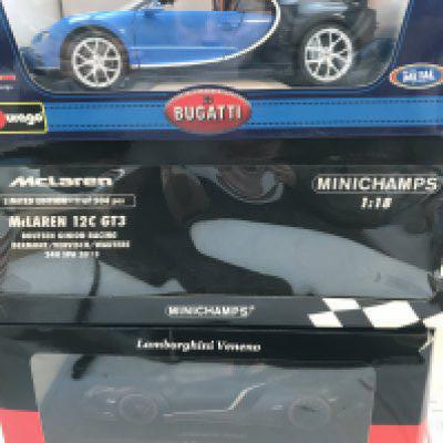 A Collection of 6 Boxed 1/18 Scale Diecast Cars including Minichamps. Burago. Maisto Etc. No Reserve.