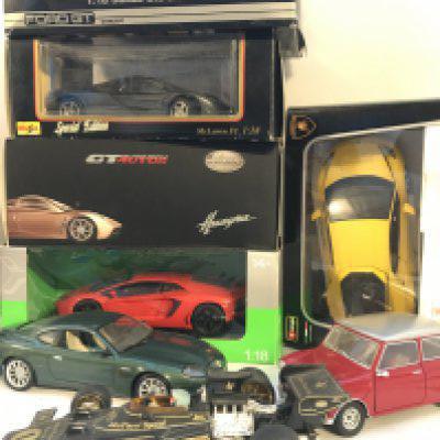 A Color Boxed And Loose Diecast Cars 1/18 Scale. Some Cars Damaged.