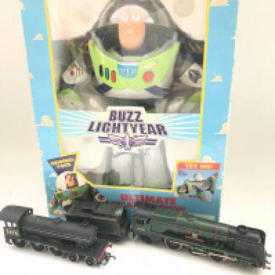 A Boxed Think Toys Buzz Lightyear and a Collection of 00 Gauge Locos. Coaches and Rolling Stock.