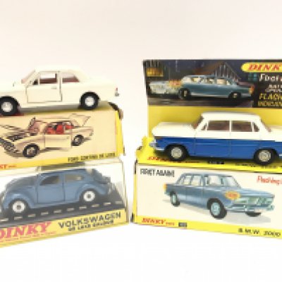 A Boxed Dinky Ford Cortina De Luxe #159. A Volkswagen De Luxe Saloon #129 and a B.M.W 2000 Toluca #157 No Battery Cover. Boxes In Various States.