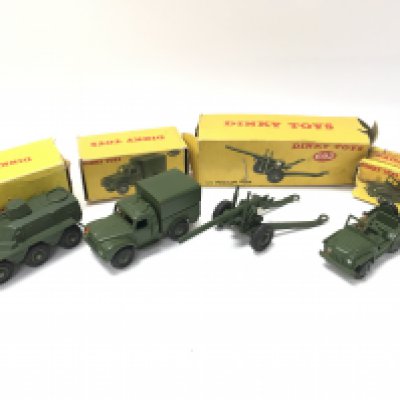 4 Boxed Dinky Military Vehicles. A Armoured Personnel Carrier #676. A Army 1-ton Cargo Truck #641. A 5.5 Medium Gun And A Austin Champ #674. Boxes In Various States.