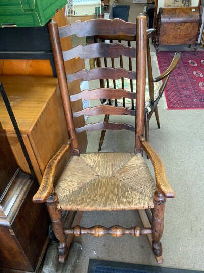 A single Lancashire ladder back dining chair together with a rocking chair example.