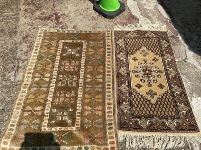 2 small wool rugs.