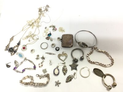 A collection of silver jewellery including earrings, necklaces, bracelets, ruby and opal pendant