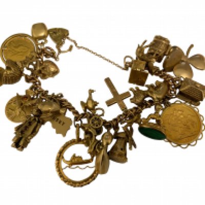 A 9ct gold charm bracelet with multiple attached gold charms and coins to include 1897 half sovereign and an 1898 full sovereign and mount.