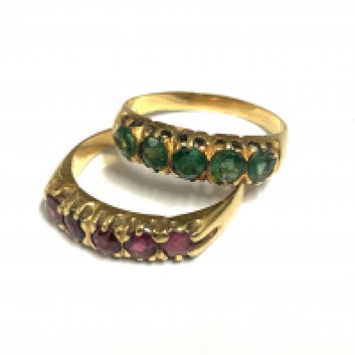 2 unmarked gold and stone set rings, both size P. 7.09g