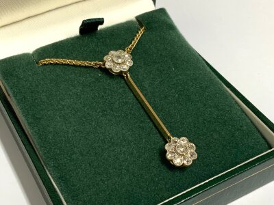 A 9ct gold necklace with 2 old cut diamond pendants, later conversion. 7.41g