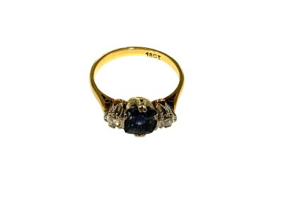 an 18ct gold diamond and blue stone dress ring, Size N.