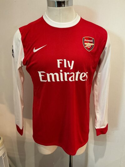 Arsenal Van Persie Match Worn Football Shirt: Red home 2010 - 2011 shirt with Champions League badge to one arm and the word Respect to the other. Rear has number 10 below the name V.Persie.