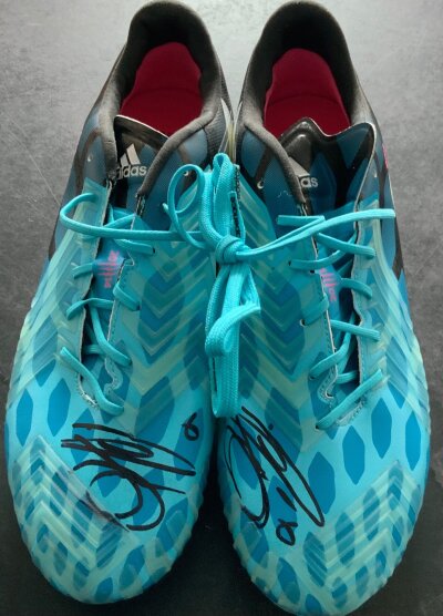 Phil Jagielka Match Issued Everton + England Football Boots: Brand new Adidas Predator pair of football boots with spare unused studs. Has the year 2014 and the letters EMZ a reference to his wife at the time Emma. Size UK 9.