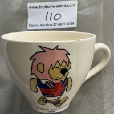 1966 World Cup Willie Football Tea Cup: White tea cup featuring a colourful WC Willie to one side. Different style to lot 101. Tiny chip and crack. 