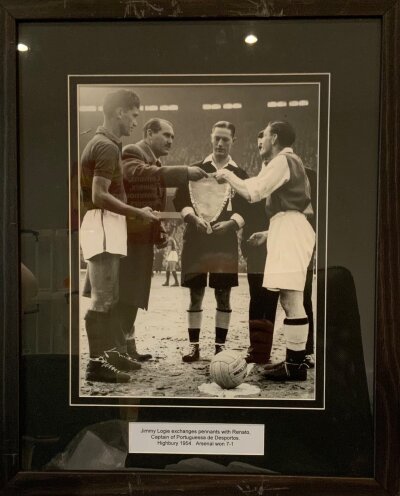 Arsenal v Portuguessa 1954 Penant Exchange Photograph: This was part of the Highbury Stadium Sale. Comes with COA and measures approximately 55 x 44cm. Slightly scratched to the frame.