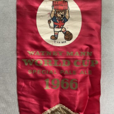 1966 World Cup Willie Watney Mann Pennant: Unusual to find in such excellent condition as they usually so signs of wear after 60 years. Measuring 16 inches high featuring WC Willie holding a barrel. Below are the words Watney Mann World Cup Special Pale Ale 1966. 