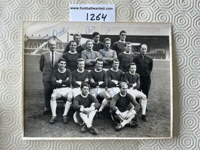 Manchester United 1960s Signed Football Press Photo: Black and white 8 x 6 inch photo with faint press stamps to rear. Signed to team picture by 12 including Law Stiles Cantwell Foulkes Gaskell and Crerand. Some not clear where they have been signed over dark background.