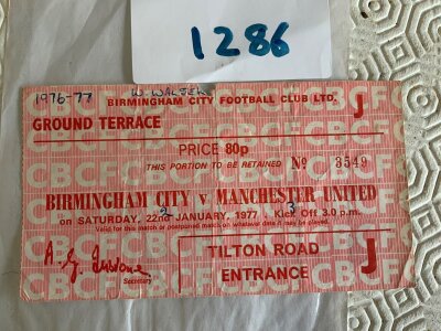 76/77 Birmingham City v Manchester United Football Ticket: League match ticket with season score and name written. Tear on fold.