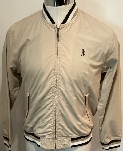 George Best Ben Sherman Brand Jacket: Brand new with tags original beige jacket in excellent unused condition. George Best/Ben Sherman labelling. Silhouette of Best to breast and Ben Sherman to sleeve. Rare piece of early Fashion.