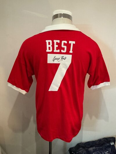 George Best Signed Manchester United Football Shirt: Retro Red short sleeve red shirt signed to the number 7 on rear below the name Best.