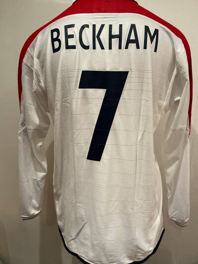 England Beckham Match Worn Football Shirt: Worn during the match in Durban v South Africa on 22 May 2003.  England won 2-1.  Excellent condition long sleeve X large Umbro shirt with match details to front.