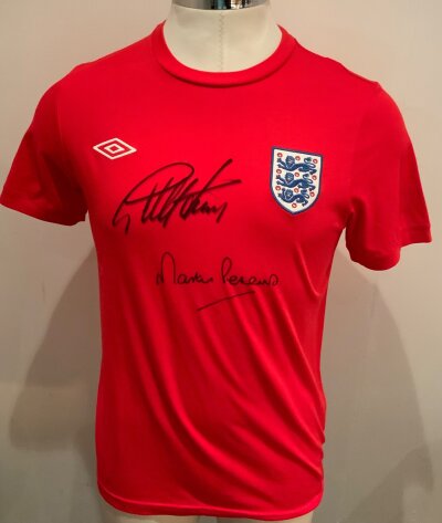 England 1966 Signed Football Shirt: Red short sleeve shirt signed to front by Hurst and Peters.
