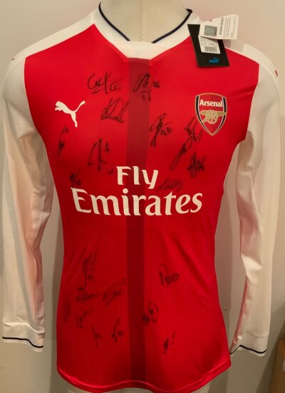 Arsenal 2016 - 2017 Signed Football Shirt: Red long sleeve home shirt. Multi Signed to front by the team. BNWT.