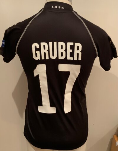 Lask 2020 - 2021 Match Worn Football Shirt: Europa League short sleeve black shirt with number 17 Gruber to rear. Worn v Tottenham.