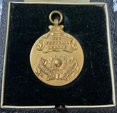 Watford 68/69 Gold Division 3 Winners Football Medal: Hallmarked gold medal in original box made by Vaughtons and Sons. The front has The Football League champions Division 3 the reverse stating 1968-69. This was awarded to Tom Walley.