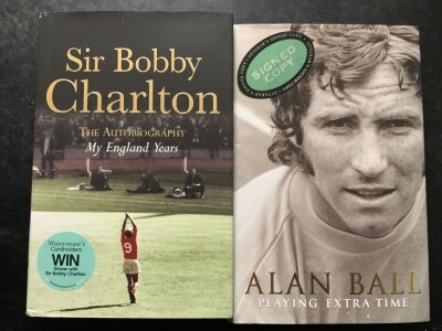 England 1966 World Cup Signed Football Books + Memorabilia: Bobby Charlton My England Years and Alan Ball Playing Extra Time both hardbacks signed without dedication. C/W 1966 retro England shirt by Geoff Hurst and a tournament programme signed to cover by Banks and Stiles. (4)