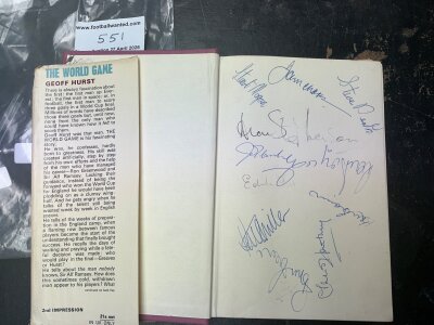 West Ham Signed Football Book: The World Game by Geoff Hurst original book with tatty dust jacket. Inside are 2 pictures signed by Bobby Moore plus on the inside blank pages at front and rear are 16 autographs to include Charles Brown Stephenson Death Dear Bonds R Cross Morgan and Boyce.