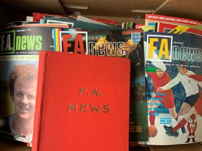 Football Magazine Collection: Many editions of FA News to include a bound volume of 1963 and many single copies in the early 70s of the lesser spotted magazine. Other magazines include Kick Team Talk France Football and more. Large box with instructions to sell.