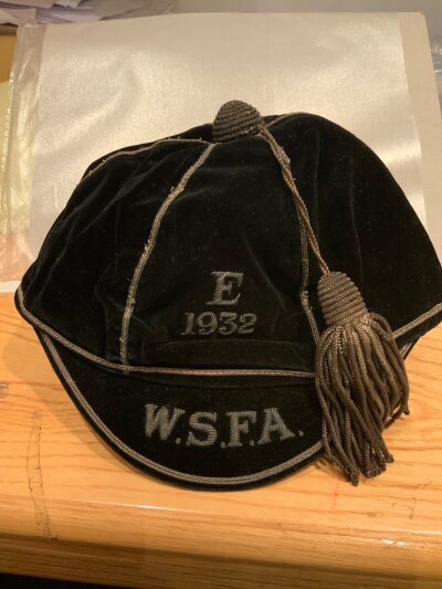 1932 Wales Schools Football Cap: Awarded to the father of Manchester United player Kenny Morgans. Front reads E 1932 a reference to opponents England. Peak has initials WSFA.