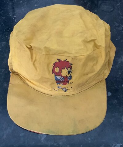 Original 1966 World Cup Willie Rain Cap: 60 year old waterproof yellow cap featuring WC Willie to front. He has a bit of wear to his legs and cap needs a wipe but this is very rare.