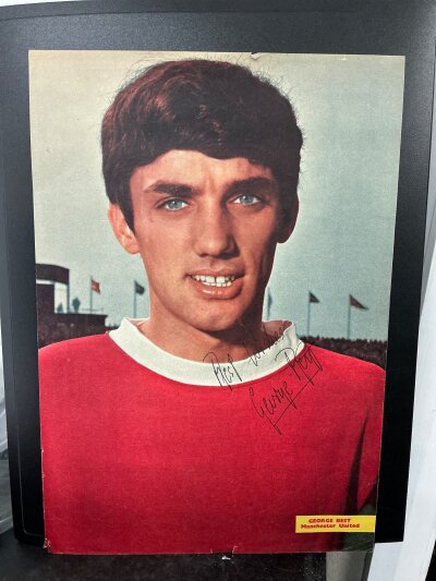 George Best Manchester United Signed Magazine Picture: Whole page featuring Best in Man Utd kit signed without dedication.