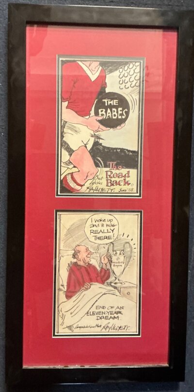 Manchester United Roy Ullyett Football Cartoons: We are informed these could be hand drawn cartoons from the famous artist but they have been framed so we are unsure. Hence this lot sold as copies. One dated June 58 with a Man Utd player carrying a black ball with The Babes written on it. The 2nd cartoon features Busby in bed with European Cup on bedside cabinet with the words I woke up and it was really there end of an eleven year dream congratulations Matt Roy Ullyett. Frame measures 13 x 27 inches.