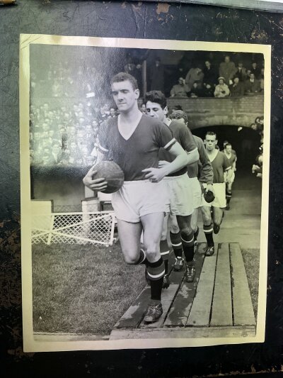 Manchester United 1950s + 1960s Football Press Photos: Includes match v Southampton 1963 FA Cup, Bill Foulkes April 1958 leading the team out, Dave Gaskell 1956 cleaning his team mates boots, team group and much more. All are press photos with one not having a stamp and a further featuring Harry Gregg playing for Ireland. All the rest are mainly large Man Utd photos.