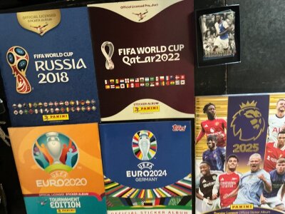 Panini Football Card Albums: World Cup 2018 2022, Euro 2020, Euro 2024 (Topps) and an empty Panini 2025. C/W a bag of cards which are modern Topps and Match Attax. Instructions to sell.