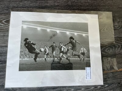 Liverpool Signed Football Print: Large quality print signed by Kevin Keegan plus a quality photo of Emlyn Hughes with the FA Cup in 1974 also signed and an unsigned Dalglish. (3)