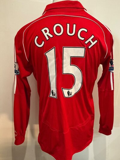 Peter a crouch Liverpool 2006 - 2008 Match Worn Football Shirt: Red long sleeve home shirt worn v Arsenal. Premier League sleeve patches to arms of which one is peeling slightly. Number 15 crouch to rear. Swapped with Kolo Toure.