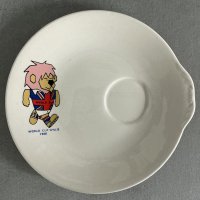 1966 World Cup Willie Saucer: Rare decorative saucer featuring a colourful WC Willie. The reverse has the official FA copyright. Looks like a saucer for a cup but has also been described as an egg cup holder. Excellent. 