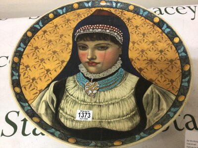 A 19th century hand painted large ceramic wall plaque portrait of a young girl in traditional dress the reverse with signature and  impressed marks and Exhibition labels. (damaged) diameter 48cm NO RESERVE