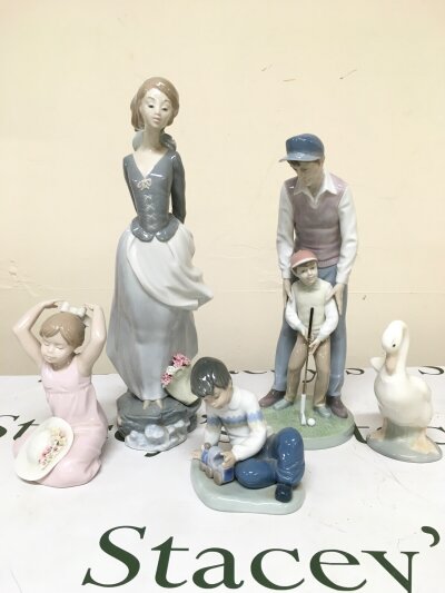 Lladro and Nao porcelain figures including Sea Breeze, Like Father like Son etc
