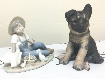 A Nadal figure and a Lenox porcelain German puppy