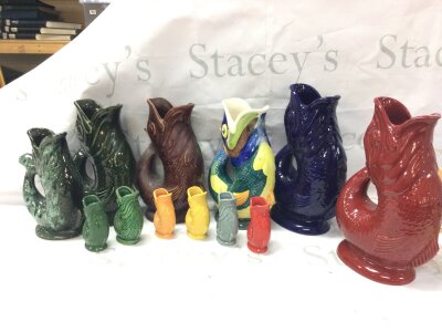 A collection of Gluggle jugs including Wade, Dartmouth Devon