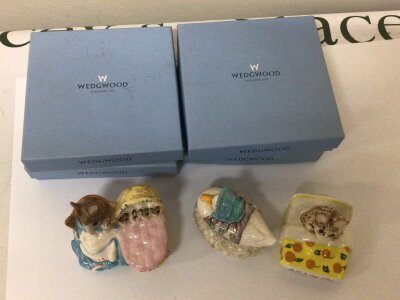 A box of mixed ceramics including boxed Wedgwood dishes Beswick Beatrix Potter figures and other oddments