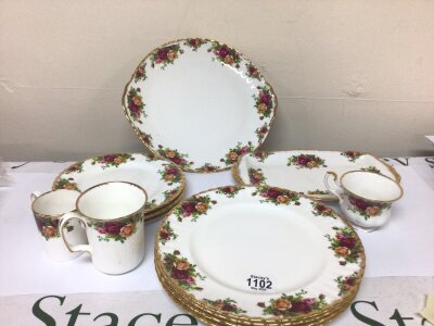 A Collection of Five Royal Albert Old English Country Rose dinner plates odd cups side plates and serving plates.