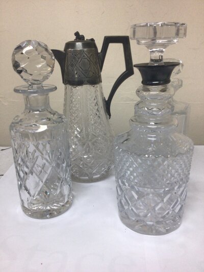 A Silver collared and cut glass decanter a cut glass claret jug and two other decanters (4)