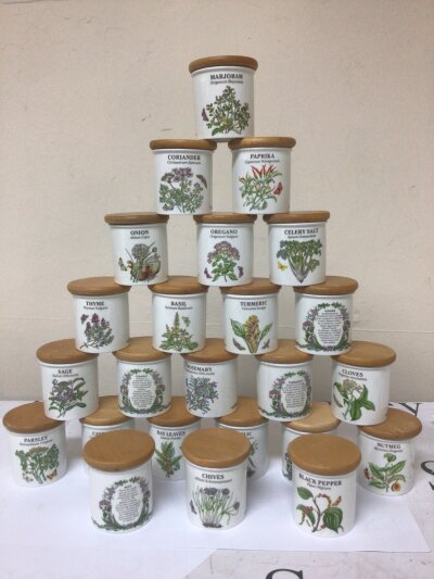 A Collection of Vintage Portmeiron Spice and herb jars each with a wood lid and with interesting detailed text about each herb and spice. And a Portmerion  No obvious damage.