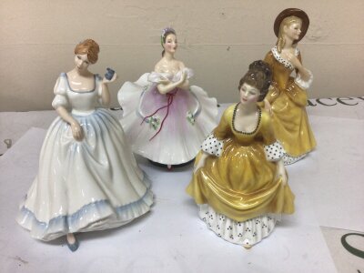 A collection of Royal Doulton lady figures (8)