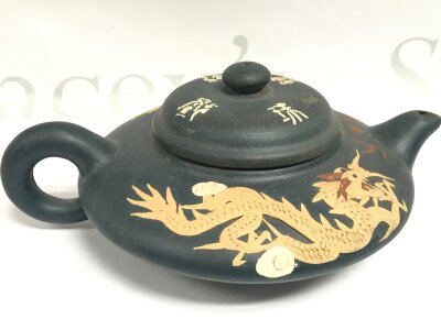 A chinese dragon teapot