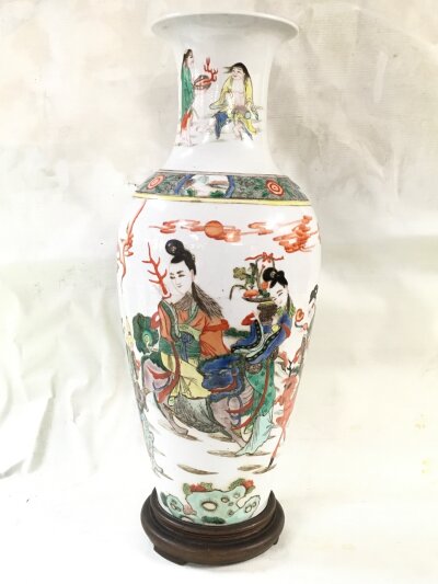 A Chinese Famille Verte style vase with a narrative scene featuring figural immortals 47cm tall. Six character mark at base